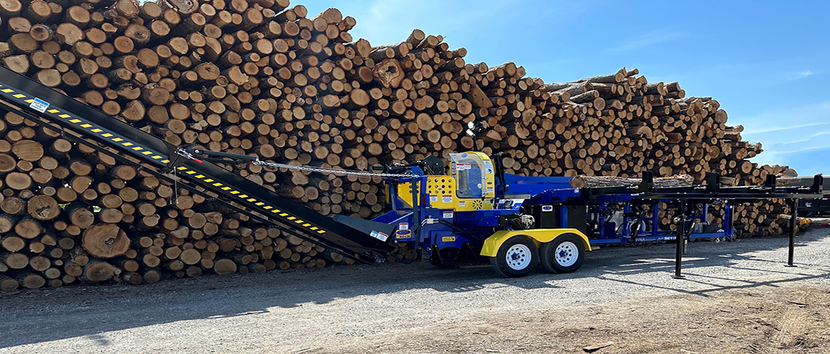 Firewood processor machines in front of DYNA